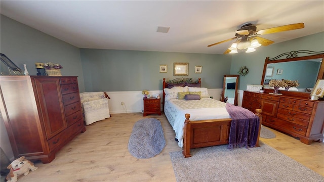 bedroom with light wood-type flooring and ceiling fan