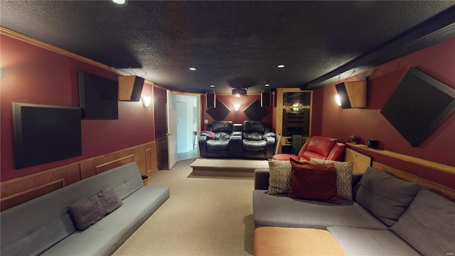 cinema with light carpet, recessed lighting, a textured ceiling, and ornamental molding