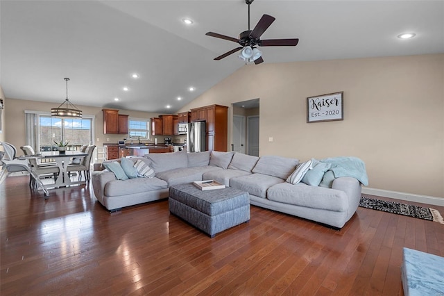 living area with baseboards, recessed lighting, dark wood-style floors, a ceiling fan, and lofted ceiling