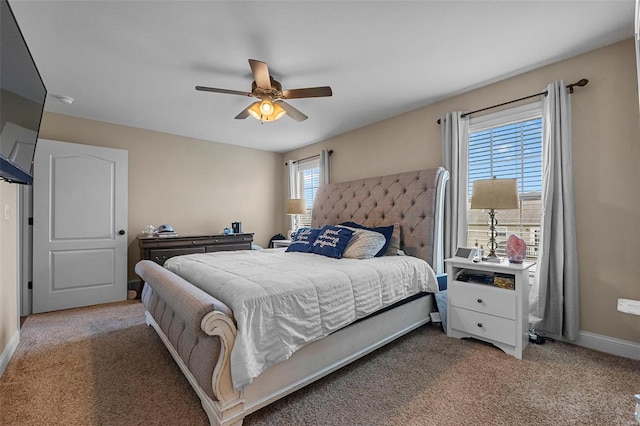 bedroom featuring carpet floors, baseboards, and a ceiling fan