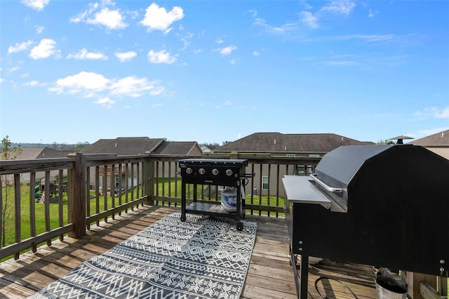 wooden terrace with area for grilling