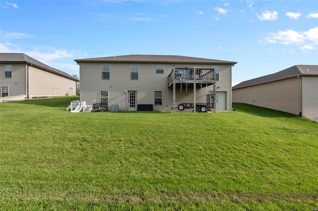 back of house with a lawn