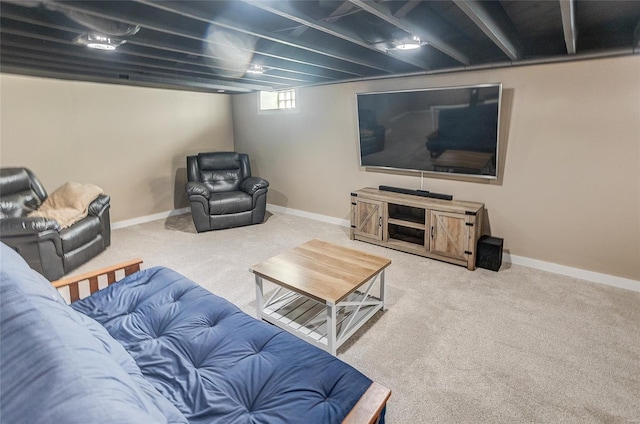 carpeted living area with baseboards
