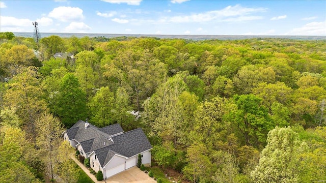 bird's eye view featuring a forest view