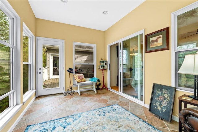 sunroom / solarium featuring baseboards