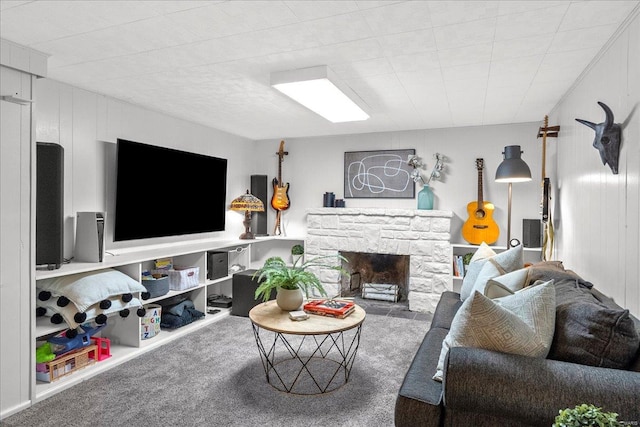living room featuring a fireplace and carpet flooring