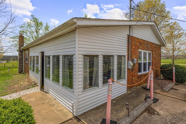 view of home's exterior with brick siding