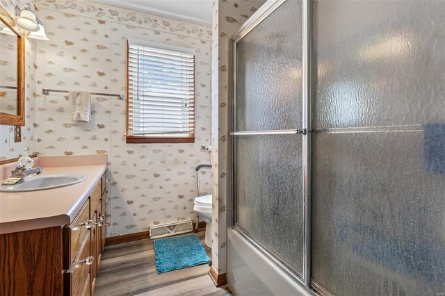 full bath with visible vents, toilet, vanity, wood finished floors, and wallpapered walls