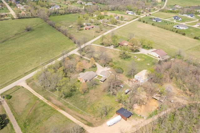 birds eye view of property with a rural view