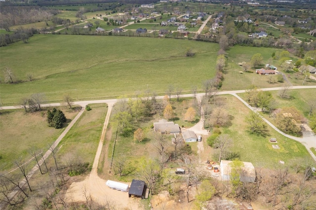 birds eye view of property featuring a rural view