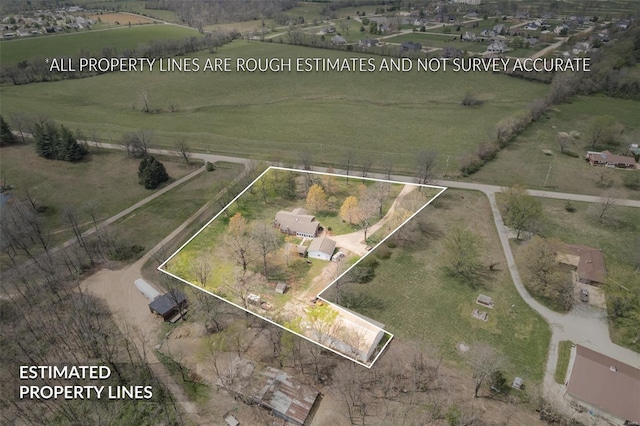 birds eye view of property featuring a rural view