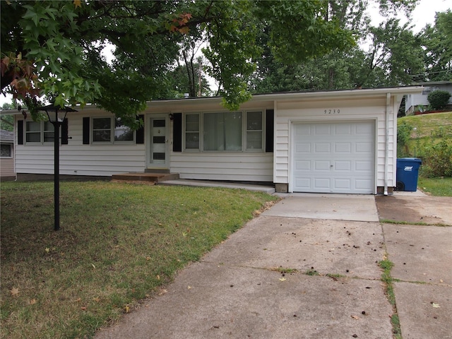 ranch-style house with a garage, a front yard, and concrete driveway
