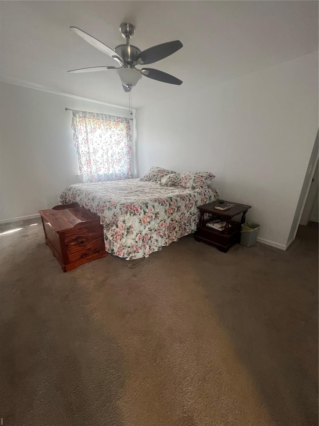 bedroom with carpet floors, baseboards, and a ceiling fan