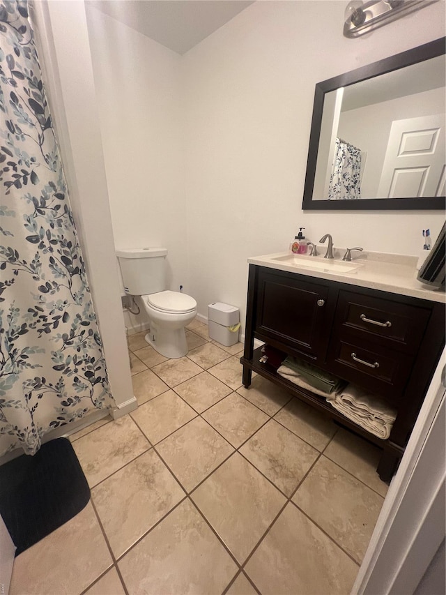 full bath featuring toilet, vanity, tile patterned flooring, and a shower with curtain
