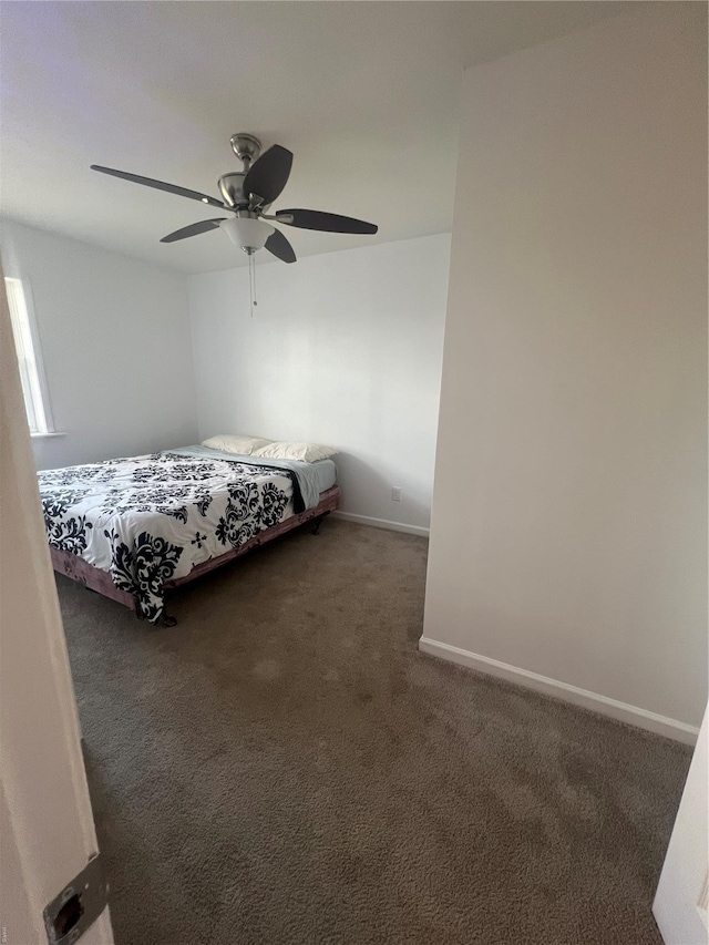 bedroom featuring baseboards, carpet flooring, and ceiling fan