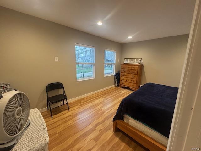 bedroom featuring recessed lighting, light wood-style floors, and baseboards