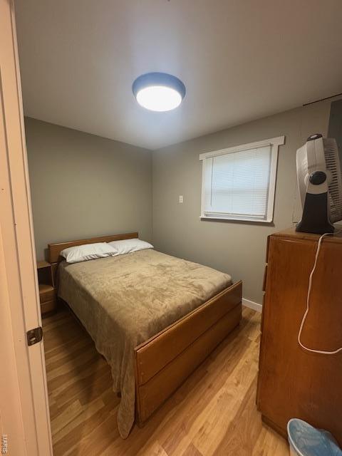 bedroom featuring light wood-style flooring