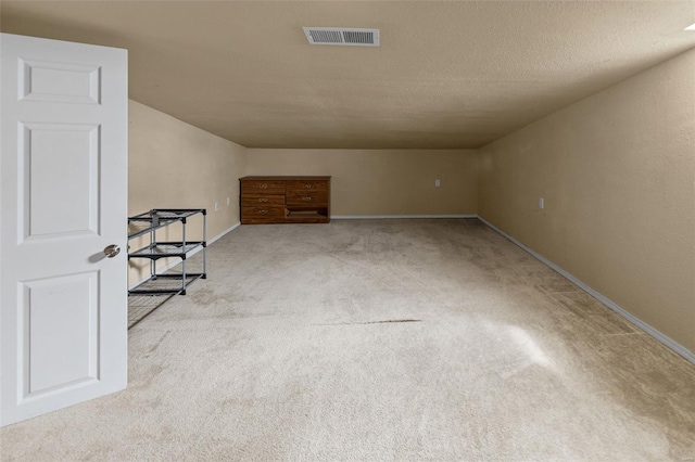 bonus room with visible vents, carpet, and baseboards