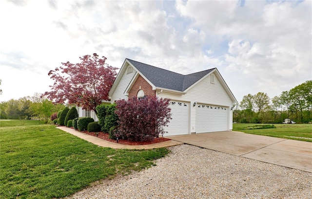 view of home's exterior with a lawn, roof with shingles, concrete driveway, and a garage