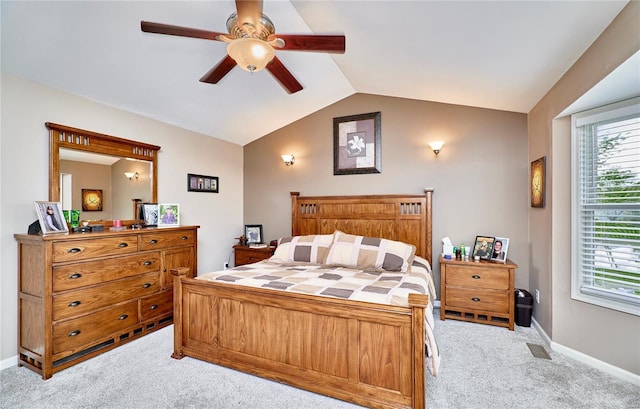 carpeted bedroom featuring ceiling fan, vaulted ceiling, and baseboards