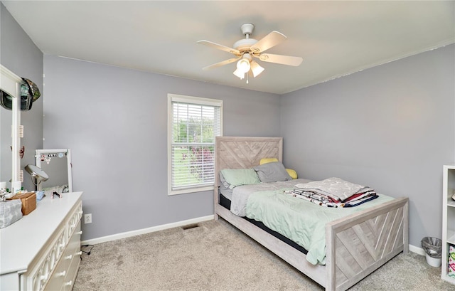 bedroom with ceiling fan, carpet floors, and baseboards
