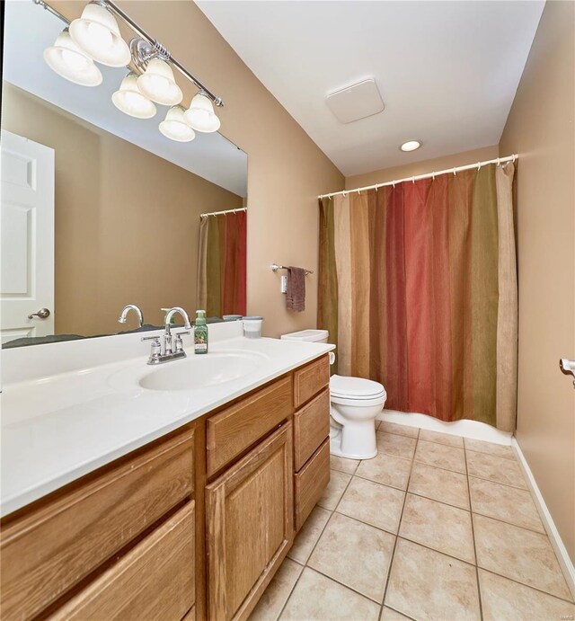 full bathroom with tile patterned floors, toilet, and vanity