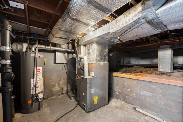 utility room featuring heating unit and water heater