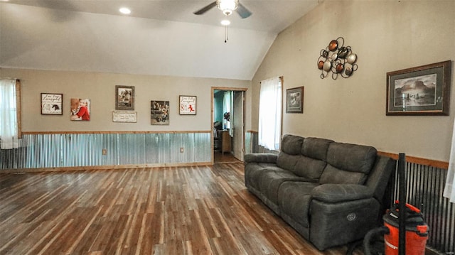 living room featuring plenty of natural light, ceiling fan, vaulted ceiling, and wood finished floors