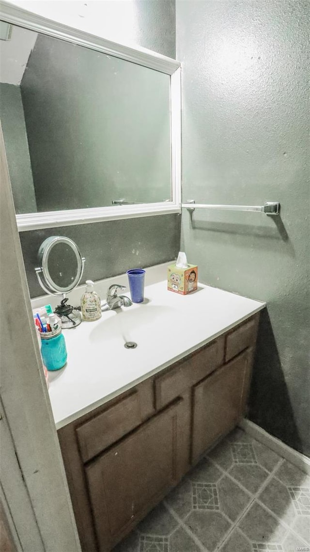 bathroom featuring tile patterned flooring and vanity