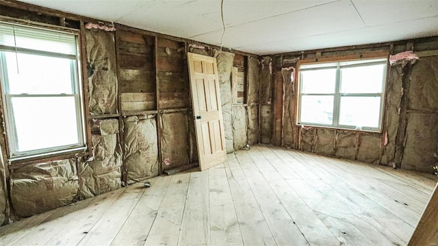 empty room with hardwood / wood-style floors