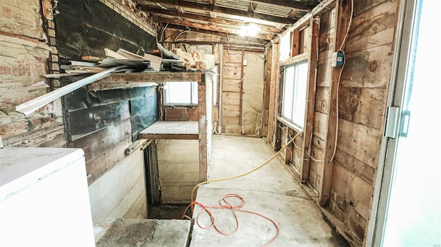 below grade area featuring washer / clothes dryer and a wealth of natural light