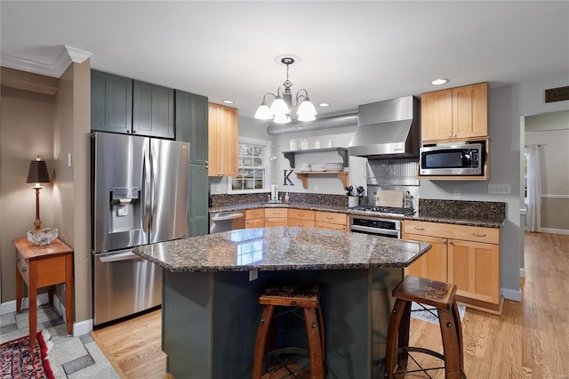 kitchen featuring light wood-style floors, wall chimney exhaust hood, open shelves, a chandelier, and appliances with stainless steel finishes