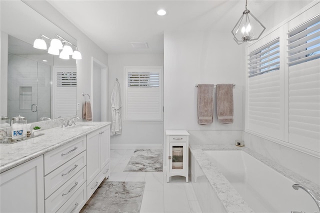 full bathroom featuring vanity, baseboards, a stall shower, marble finish floor, and a garden tub
