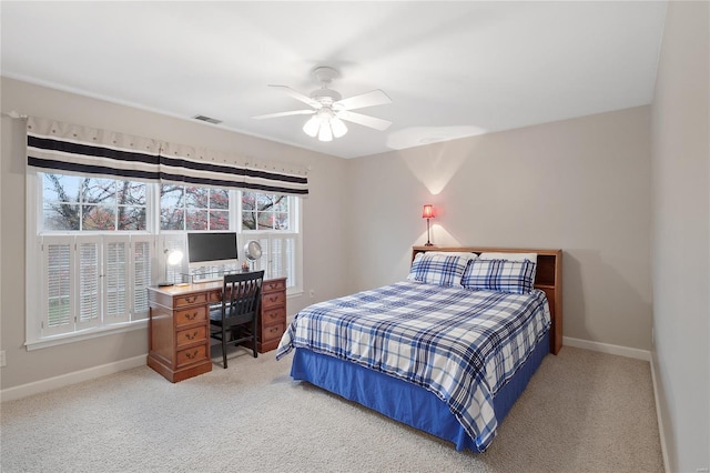 bedroom with carpet, visible vents, baseboards, and ceiling fan