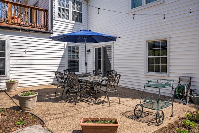 view of patio featuring a balcony