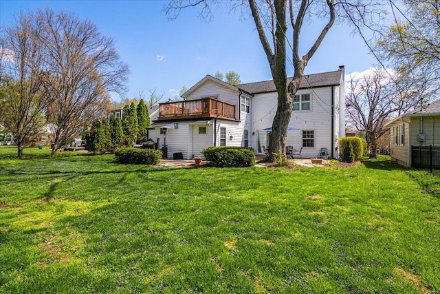 rear view of house with a lawn