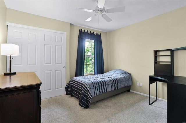 bedroom with baseboards, ceiling fan, and carpet flooring