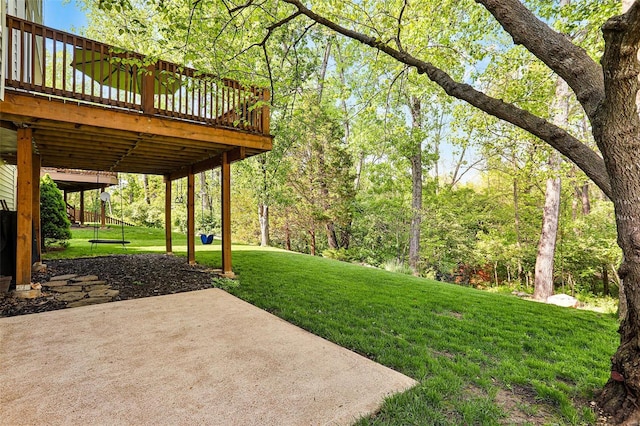 view of yard featuring a patio and a deck