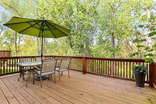 wooden deck featuring outdoor dining space