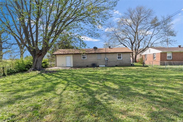back of house featuring a yard, fence, and cooling unit