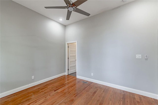 empty room with light wood-style floors, a ceiling fan, baseboards, recessed lighting, and visible vents
