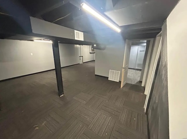 finished below grade area featuring visible vents and baseboards