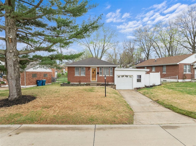 view of front of property with concrete driveway, a front lawn, an attached garage, brick siding, and fence
