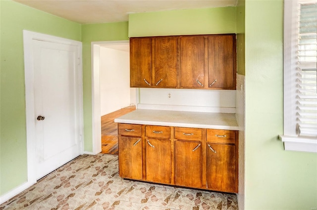 kitchen with brown cabinets and light countertops