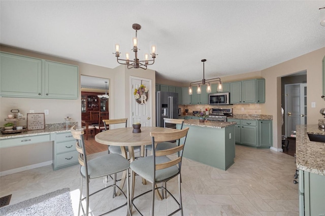 dining room with baseboards and a notable chandelier