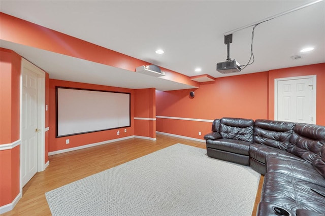 cinema featuring recessed lighting, light wood-style flooring, and baseboards