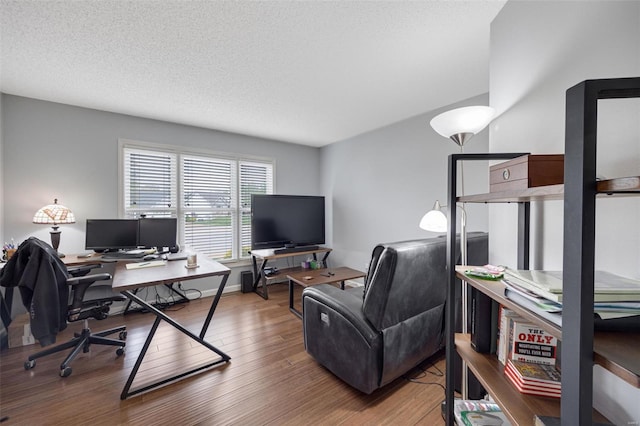 office featuring a textured ceiling and wood finished floors