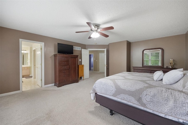 bedroom with visible vents, a ceiling fan, baseboards, connected bathroom, and carpet flooring