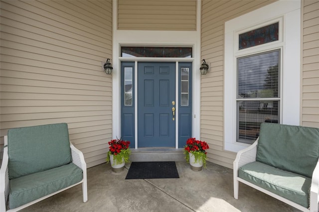 view of exterior entry featuring a porch