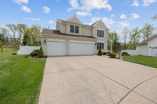 view of front of house with a garage, a front lawn, fence, and concrete driveway